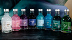 200ml bottle of coloured shimmer gin by Newy Disitllery. White, Pink, Purple, Butterfly Pea, Sky Blue, Blue, Turquoise, Green.