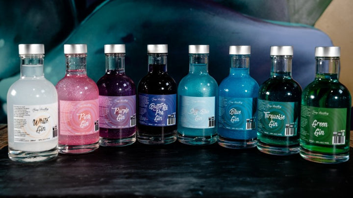 200ml bottle of coloured shimmer gin by Newy Disitllery. White, Pink, Purple, Butterfly Pea, Sky Blue, Blue, Turquoise, Green.