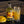 Load image into Gallery viewer, Mango Gin Liqueur 700ml bottle displayed next mango cocktail in tall glass with fresh mango garnish. Mango gin lIqueur, fruit gin liqueur by Newy Disitllery.
