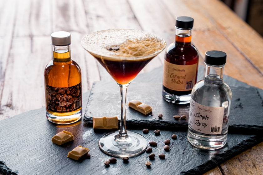 Newy Distillery Caramel Espresso Martini Cocktail Kit. Cocktail displayed with 3 bottles.
