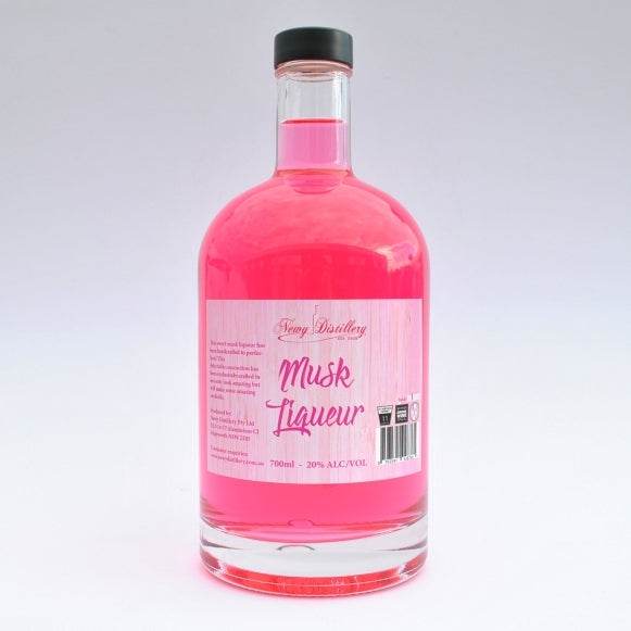 Bottle of pink liqueur with a label on a white background